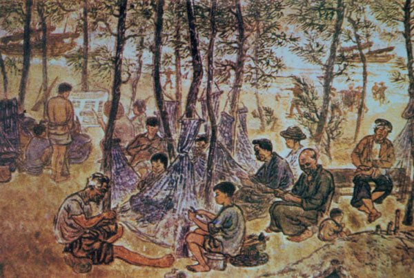 Réparer les filets à la plage (sculpture sur bois) de Nguyen Trong Hop